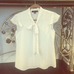 NWOT short sleeve polka dot blouse. Never worn!